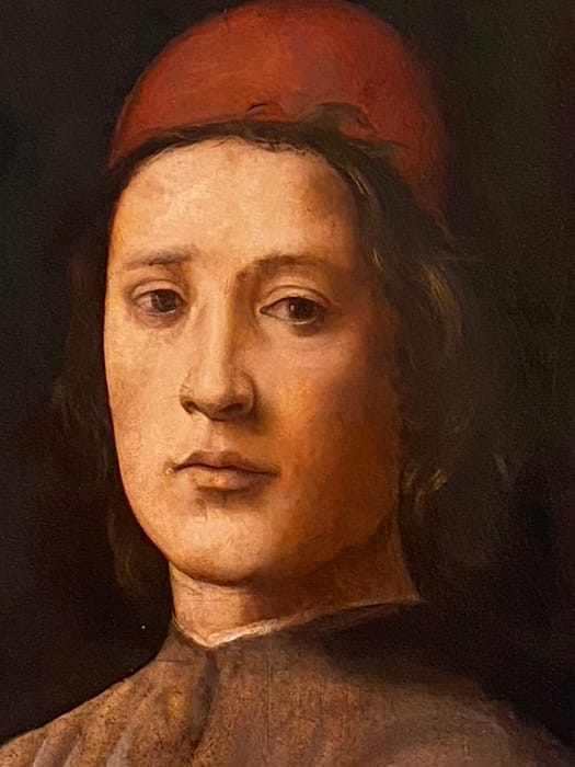 Retrato clásico de hombre con gorro rojo